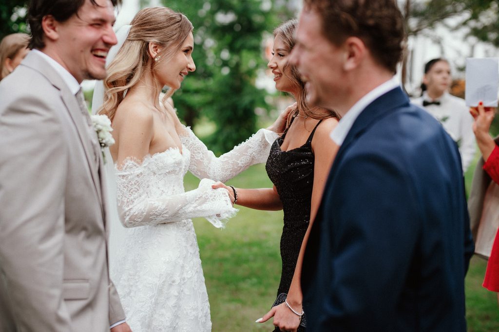 The newlyweds with guests after the ceremony, wedding at Chateau Appony, Oponice