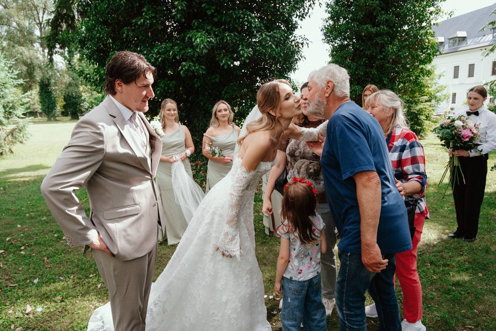 Guests congratulating the bride in the park, wedding at Chateau Appony, Oponice