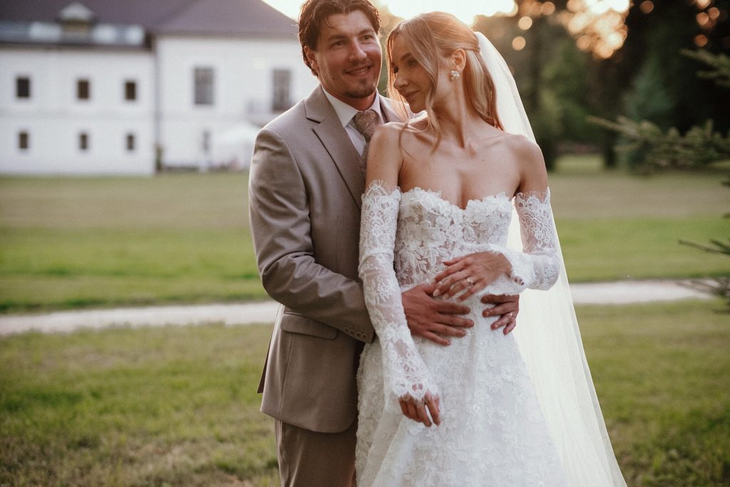The newlyweds embracing in the park, wedding at Chateau Appony, Oponice