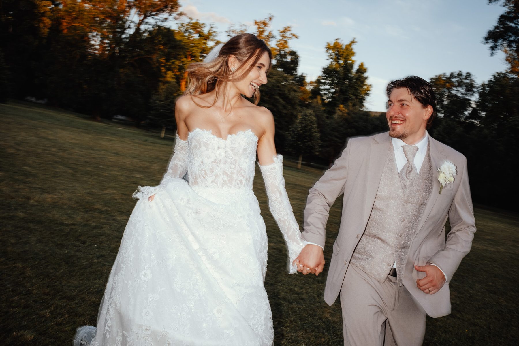 Monika and David walking through the chateau park, wedding at Chateau Appony, Oponice
